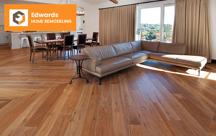 Open kitchen with warm hardwood flooring enhancing the design.